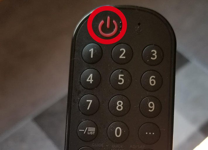 Long press the power button on LG TV remote